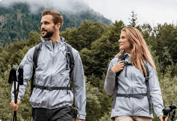 a man and woman with hiking gear