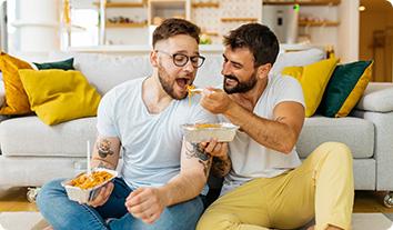 two men eating a meal