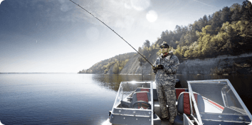 a man fishing from a boat