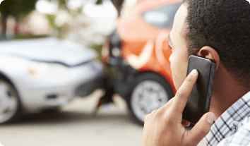 a man on the phone after a car accident