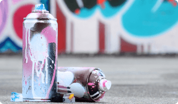 cans of spray paint by graffiti