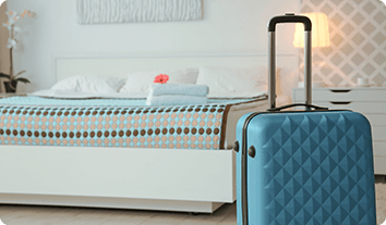 a bed with a blue and white bed spread