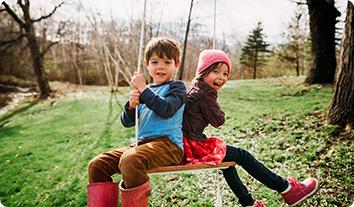 two boys on a swing