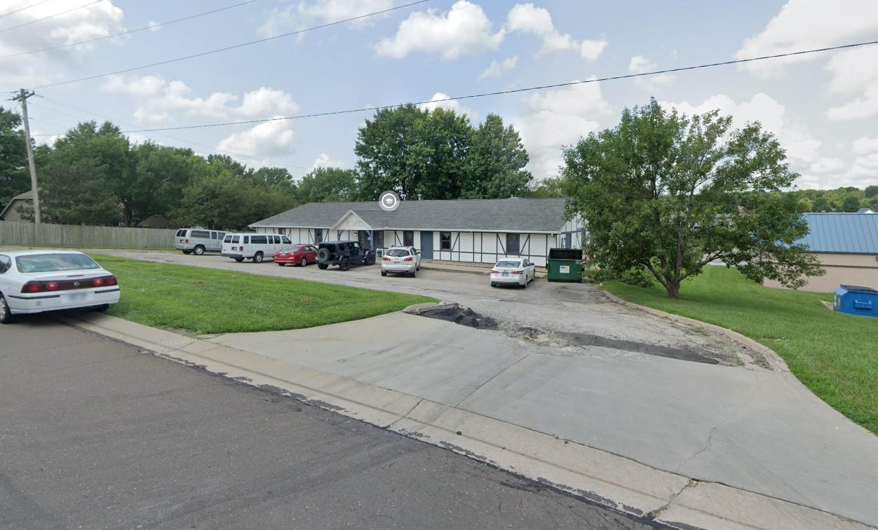 a group of cars parked in a parking lot