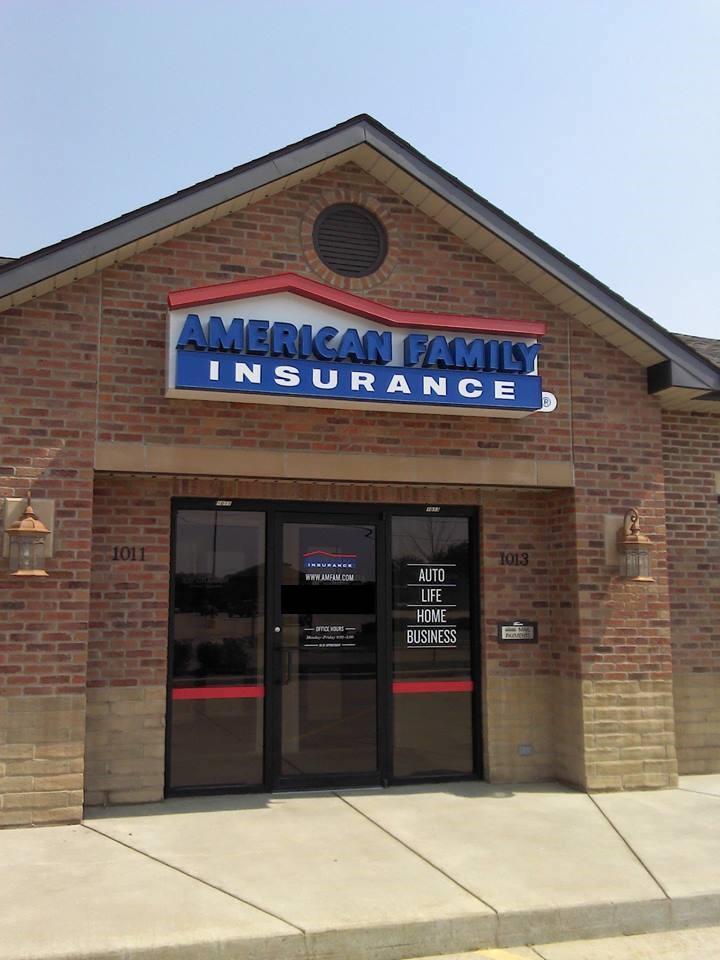 a brick building with a sign on it