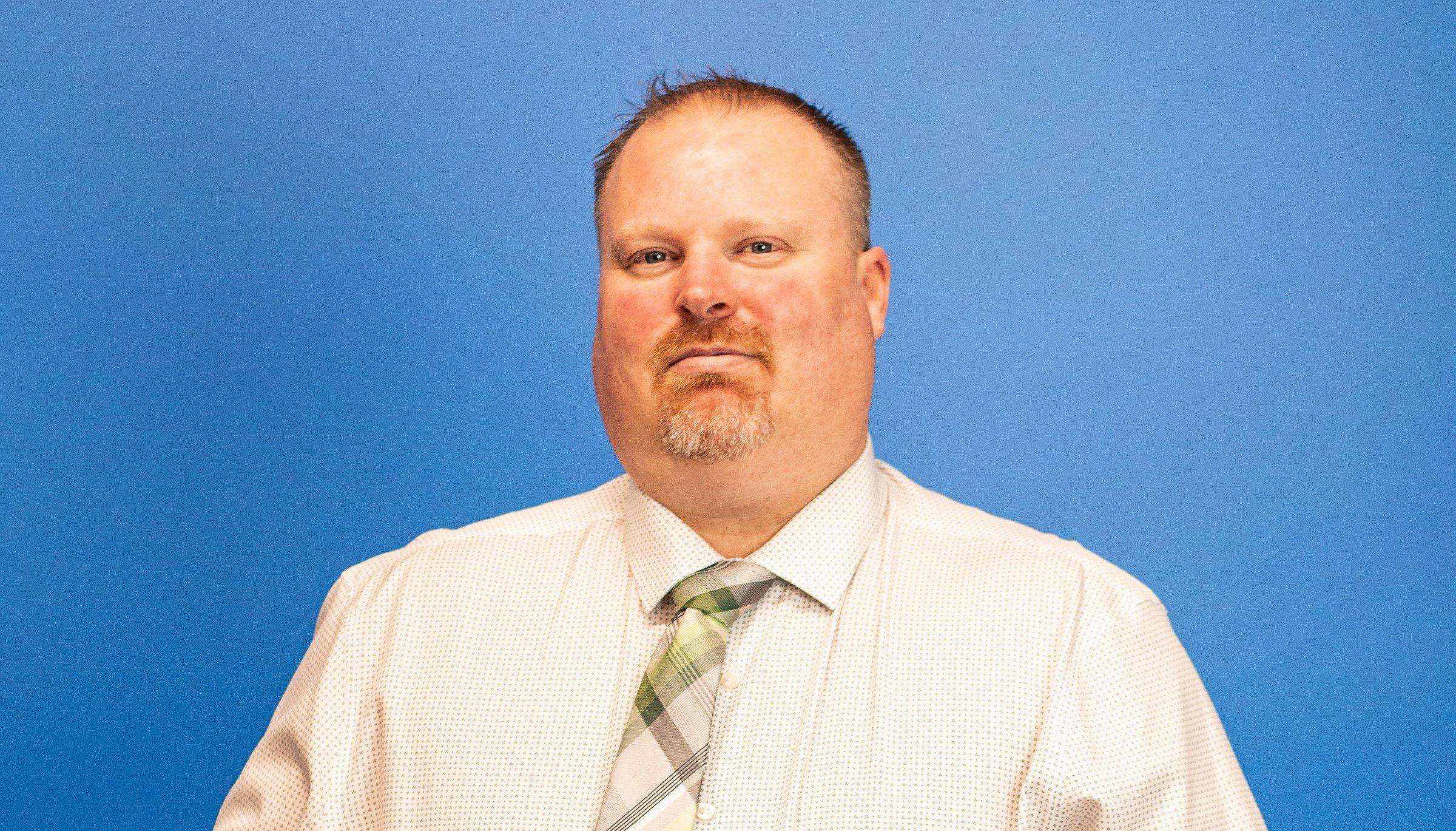 a man in a white shirt and tie