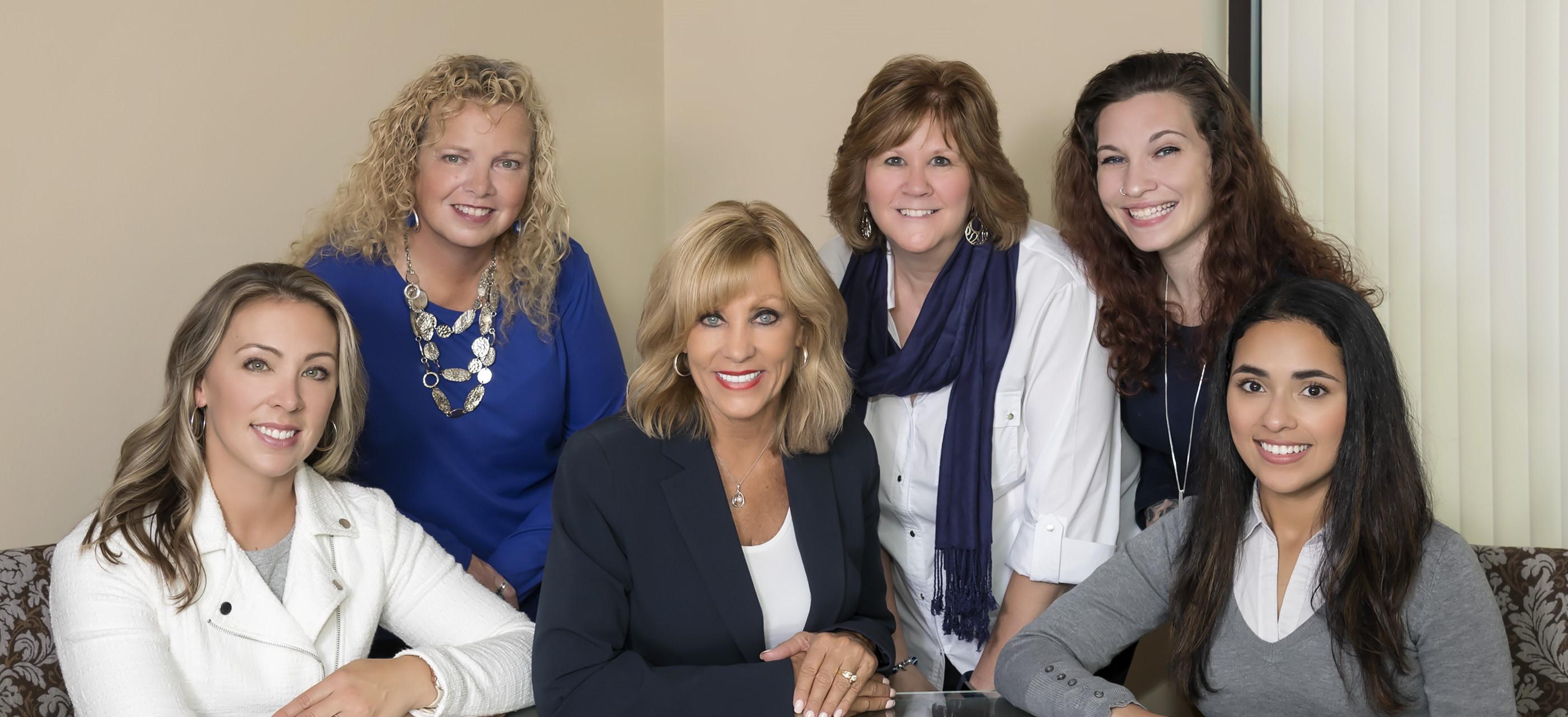 a group of women posing for a photo