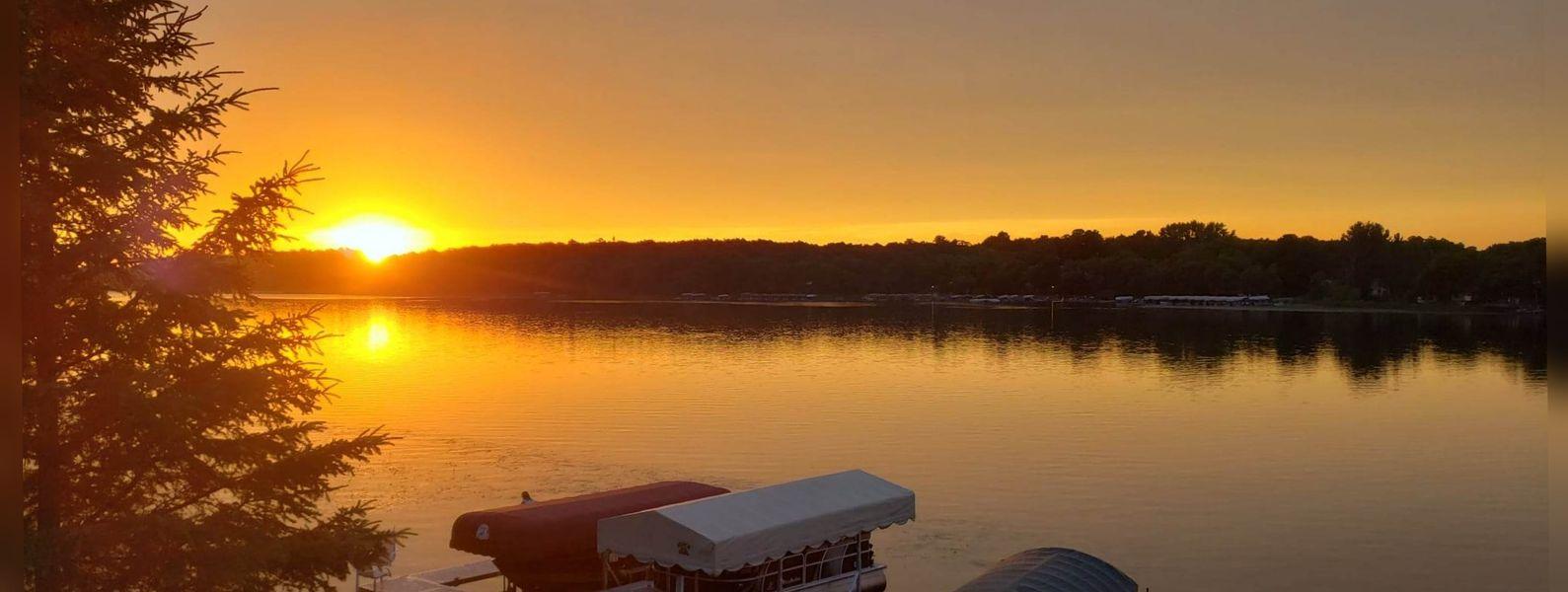 a sunset over a lake