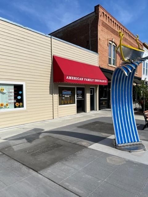 a building with a red awning