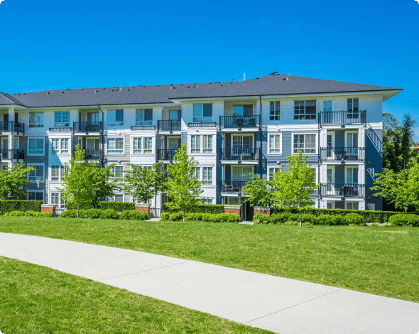 a view of condominiums on a sunny day