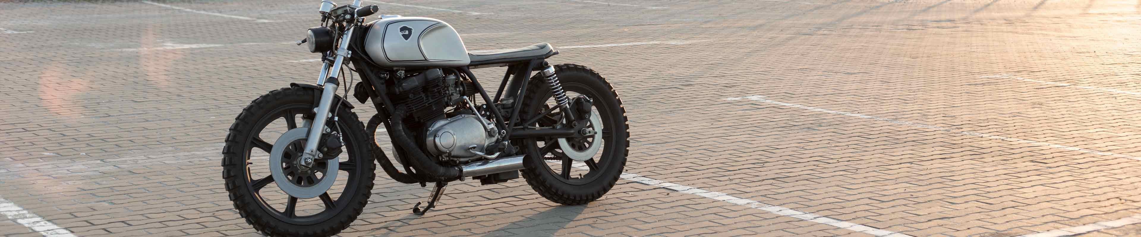 A used motorcycle parked in a parking lot.