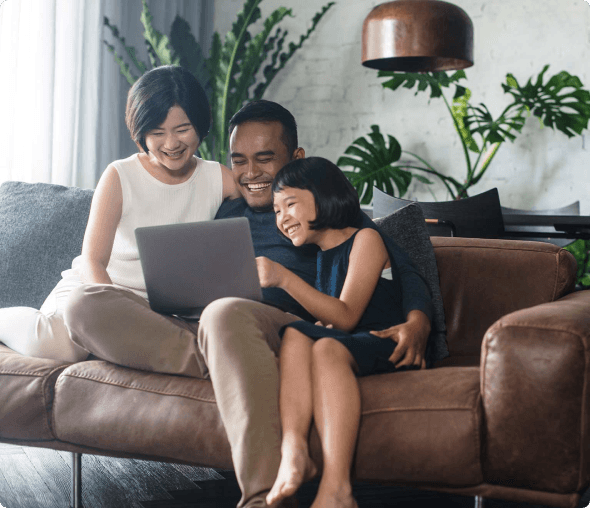 a family sitting on a couch