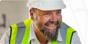 a man with a beard and a white hat