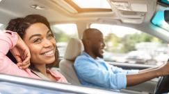 a woman and a man in a car