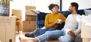 a man and a woman sitting on the floor