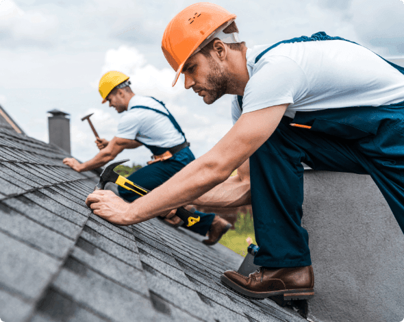 Workers fixing a roof. 