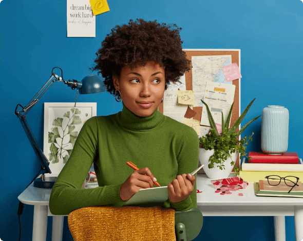 a woman writing down goals