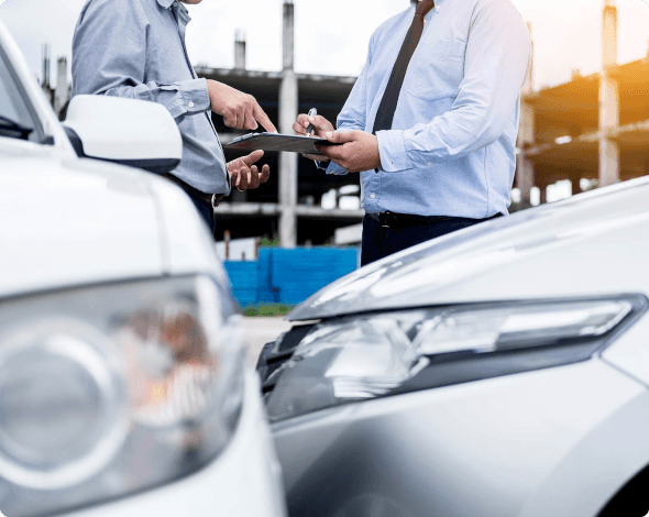 men exchanging information after a car accident