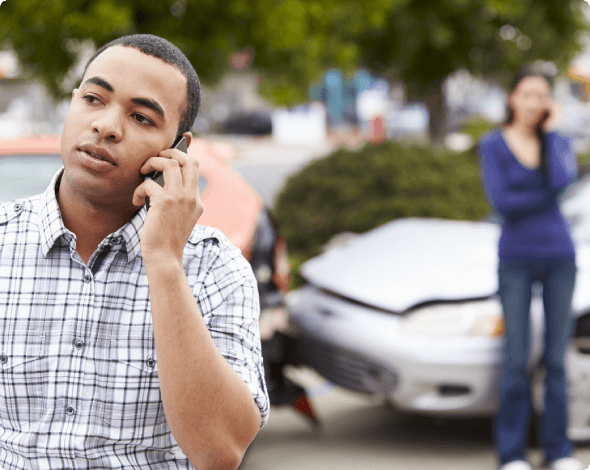 a man on the phone after a car accident