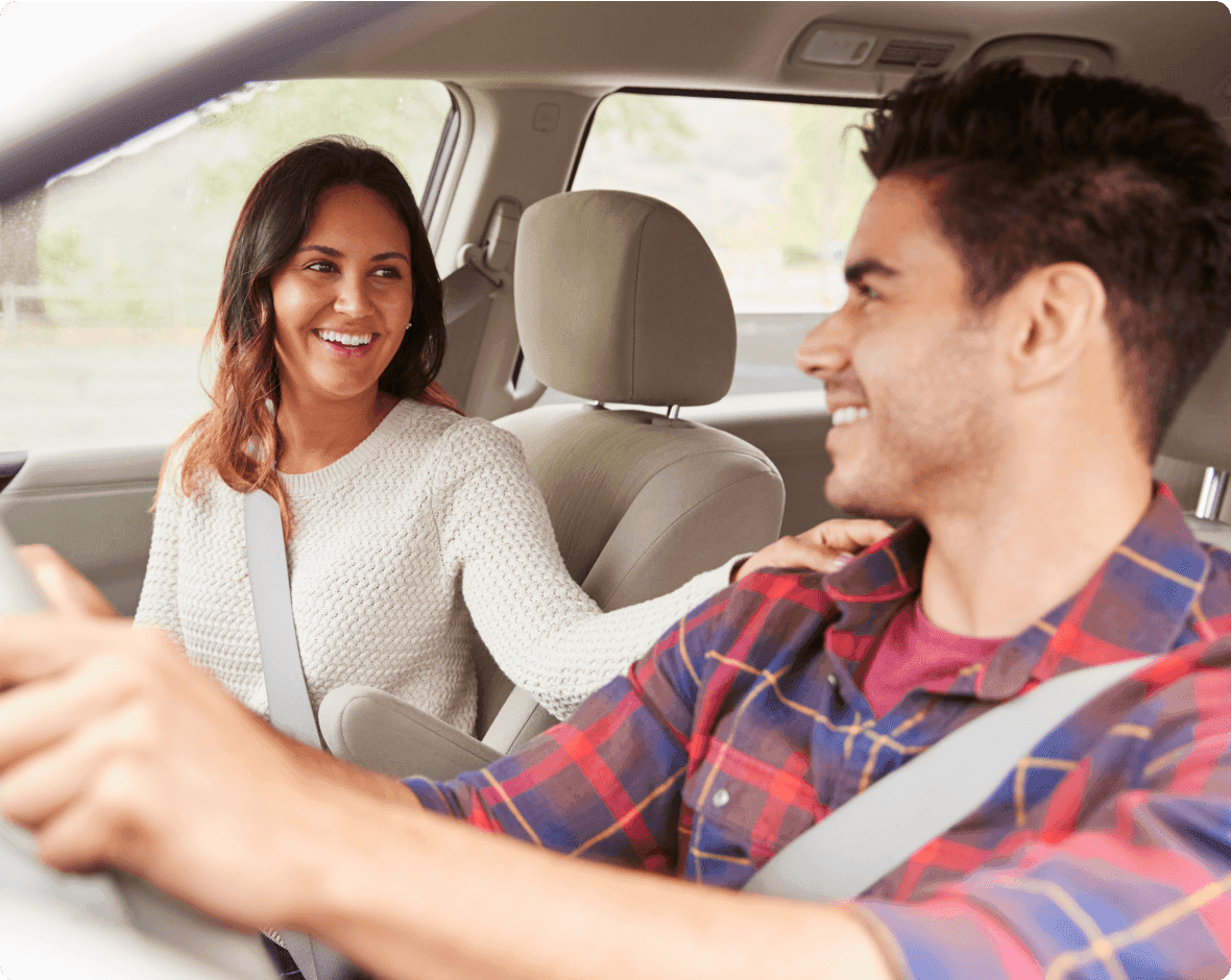 a man and a woman in a car